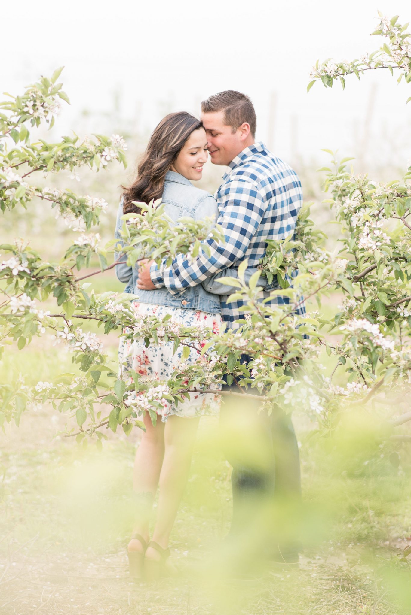 Couple nestled in the tree line during engagement photos by Indianapolis wedding photographer Victoria Rayburn Photography