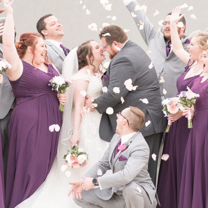 Bridal party celebrates with flower petals during wedding photos by Indianapolis wedding photographer Victoria Rayburn Photography
