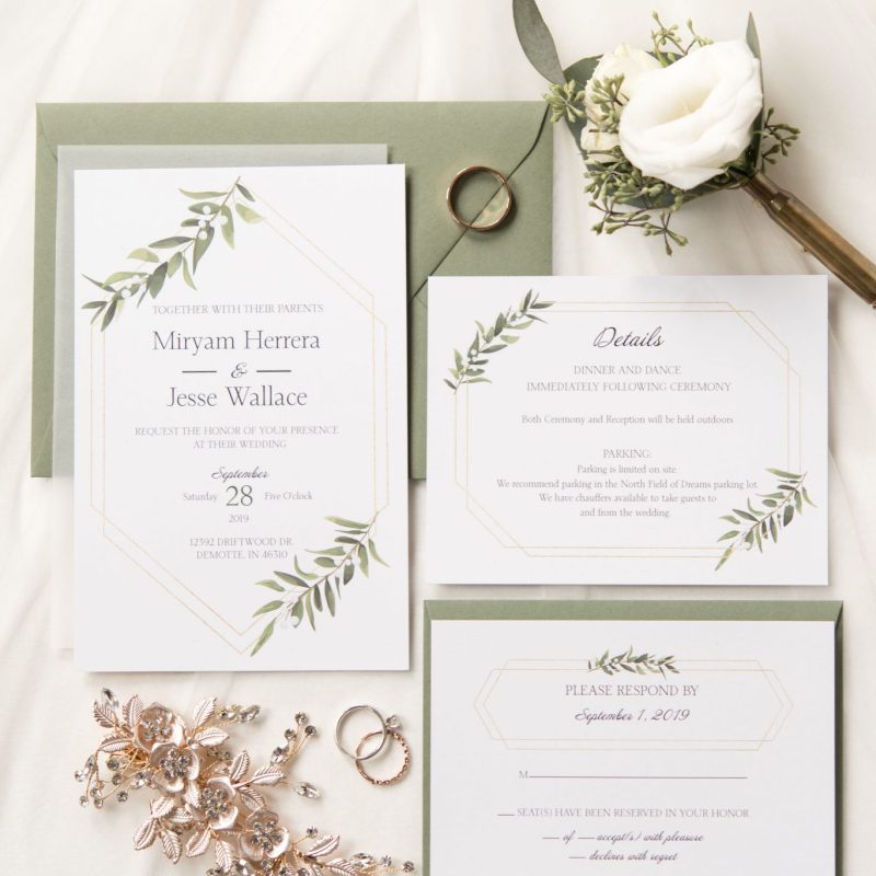 Invitation flat lay with gold and green accents by Indianapolis wedding photographer Victoria Rayburn Photography
