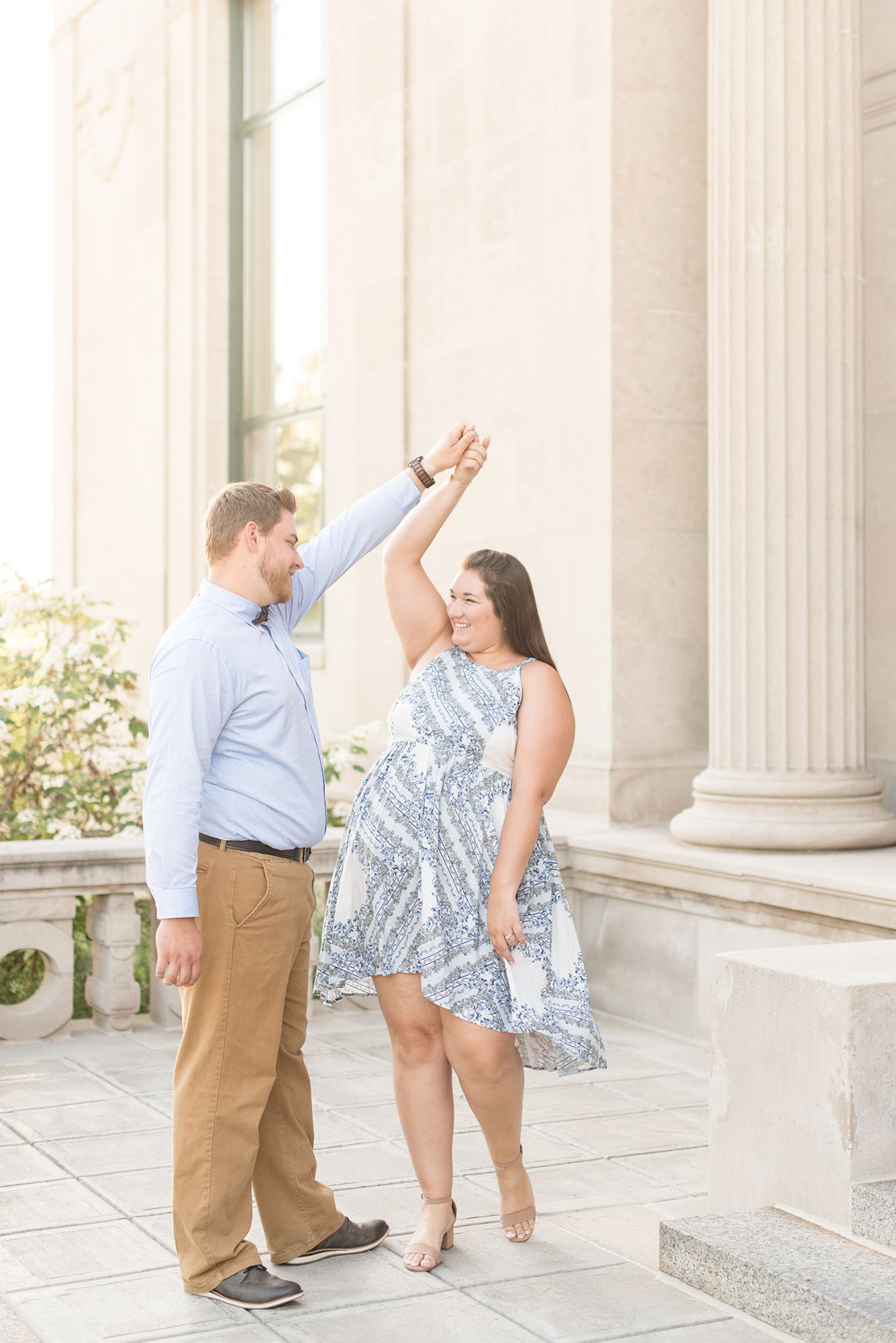 Couple dances downtown during engagement photos by Indianapolis wedding photographer Victoria Rayburn Photography