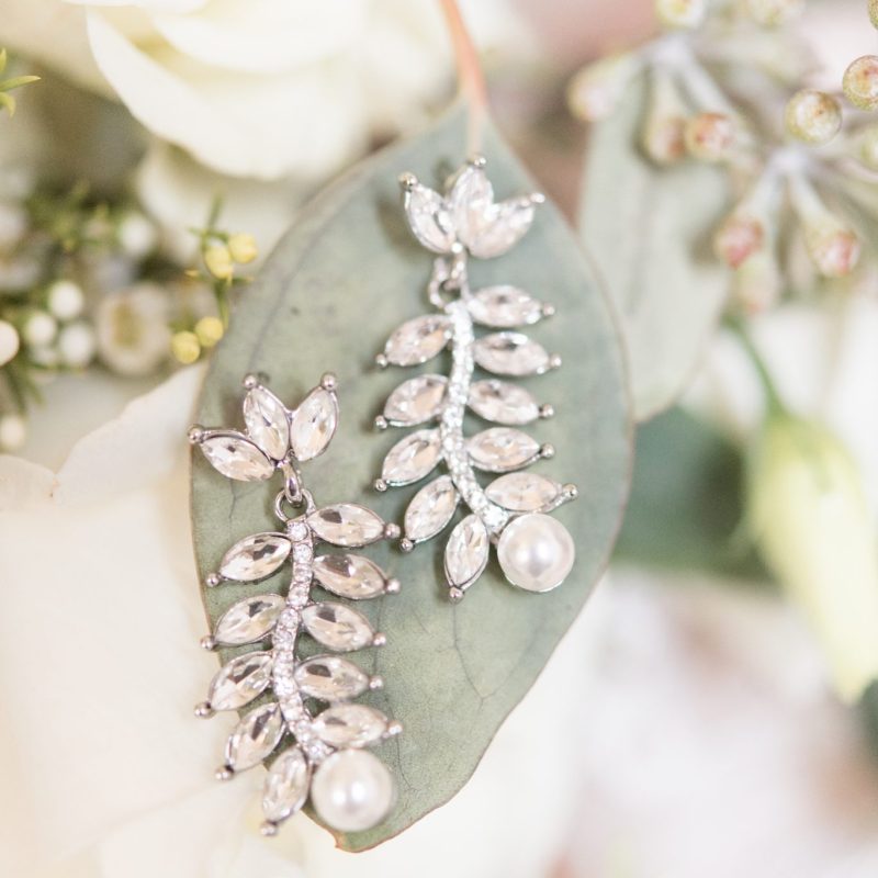Diamond and pearl earrings on bridal bouquet by Indianapolis wedding photographer Victoria Rayburn Photography