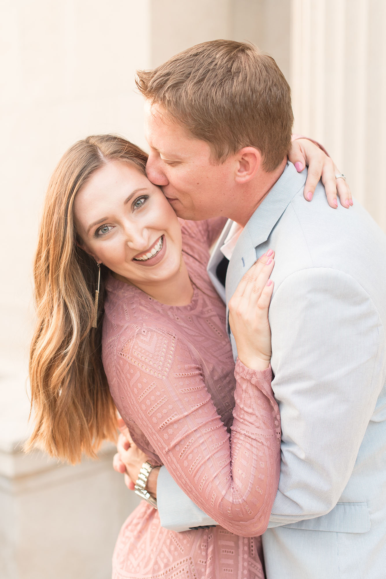 Man kisses his fiancee during engagement photos by Indianapolis wedding photographer Victoria Rayburn Photography