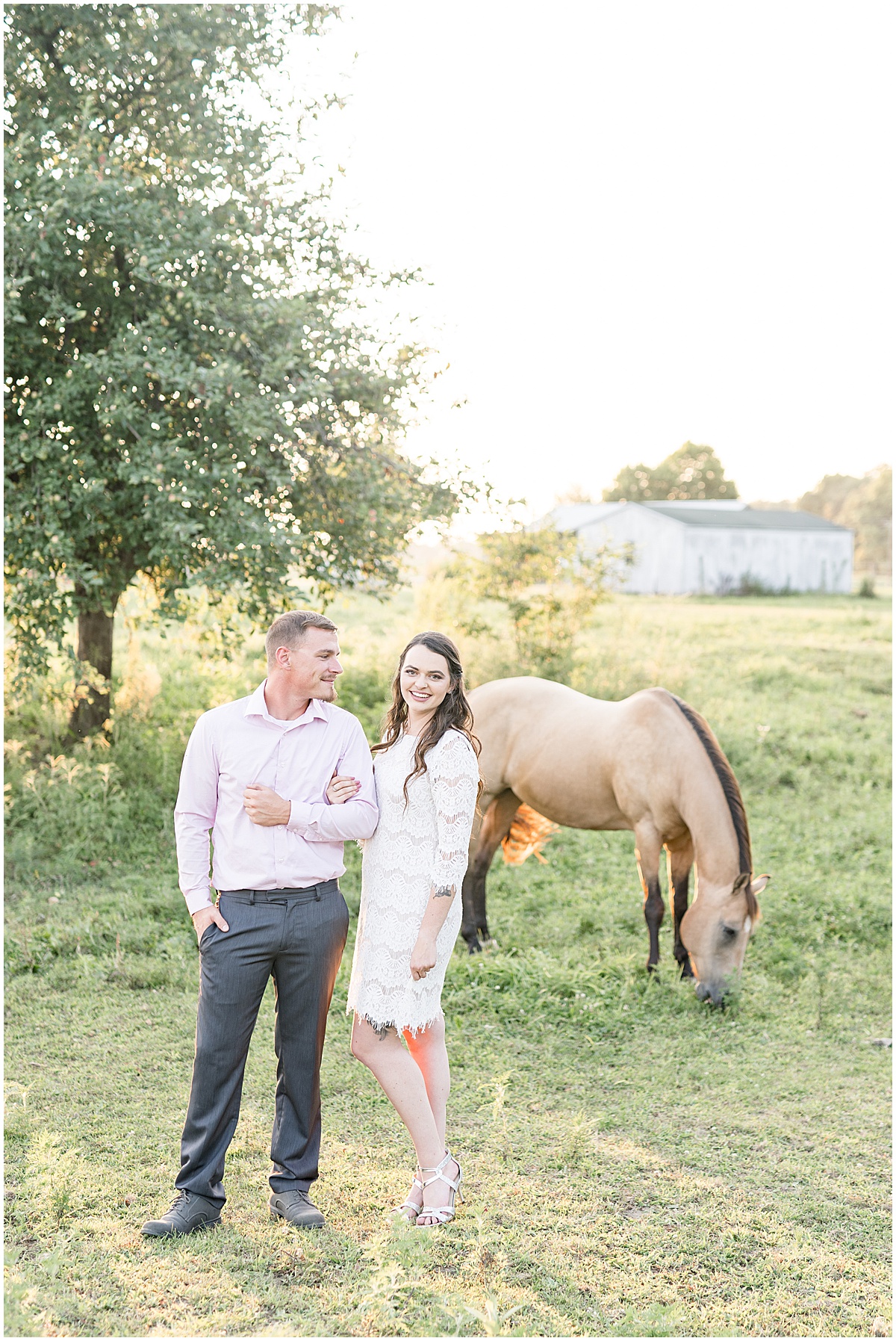Couple in front of horse during engagement photos by Indianapolis wedding photographer Victoria Rayburn Photography