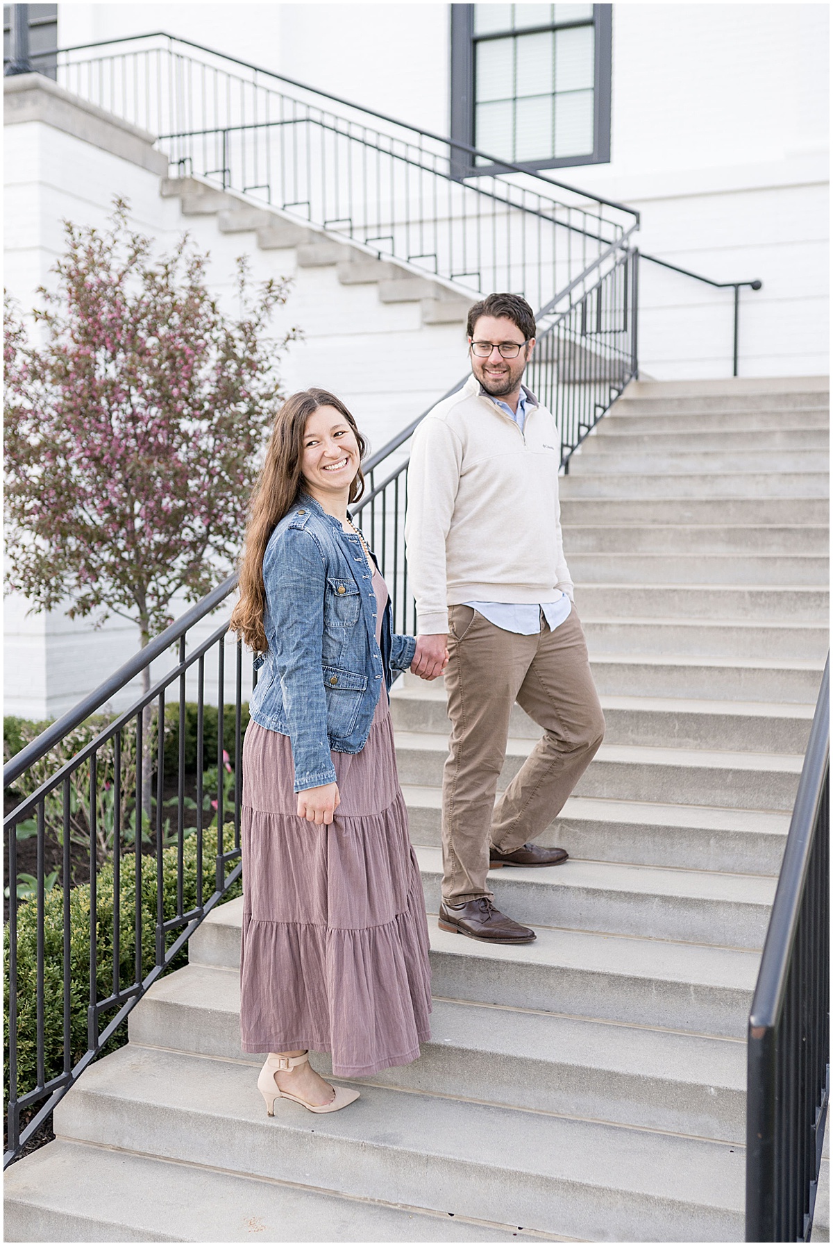 Couple walking up steps for engagement photos by Indianapolis wedding photographer Victoria Rayburn Photography