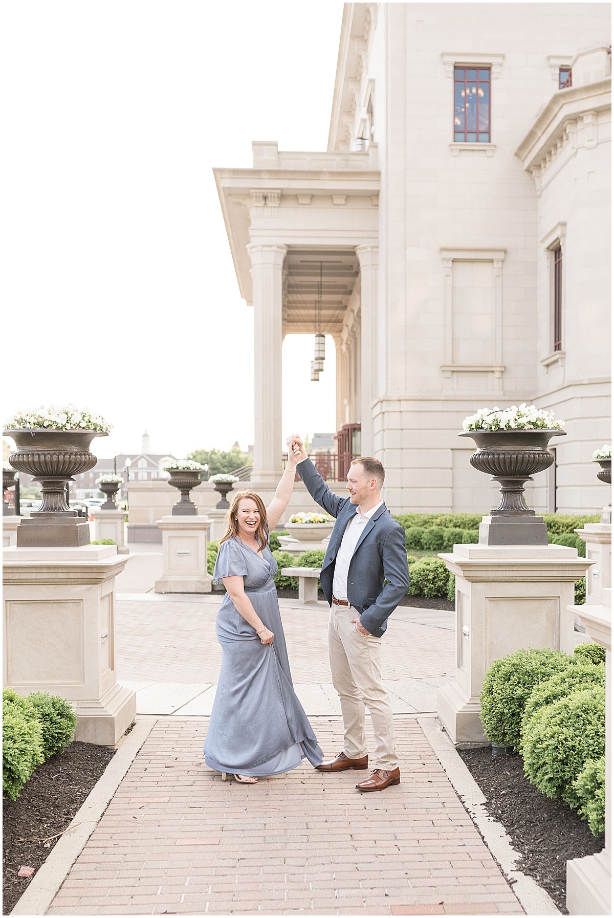 Couple dances outside Palladium for photos by Indianapolis wedding photographer Victoria Rayburn Photography