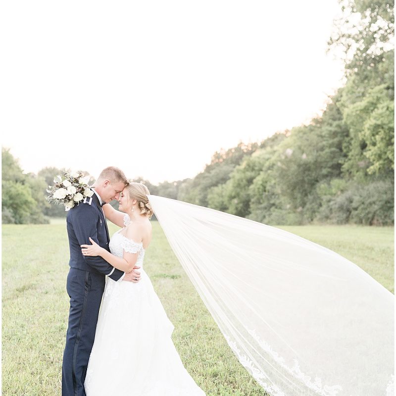 Bride's veil blows in wind during sunset photos by Indianapolis wedding photographer Victoria Rayburn Photography