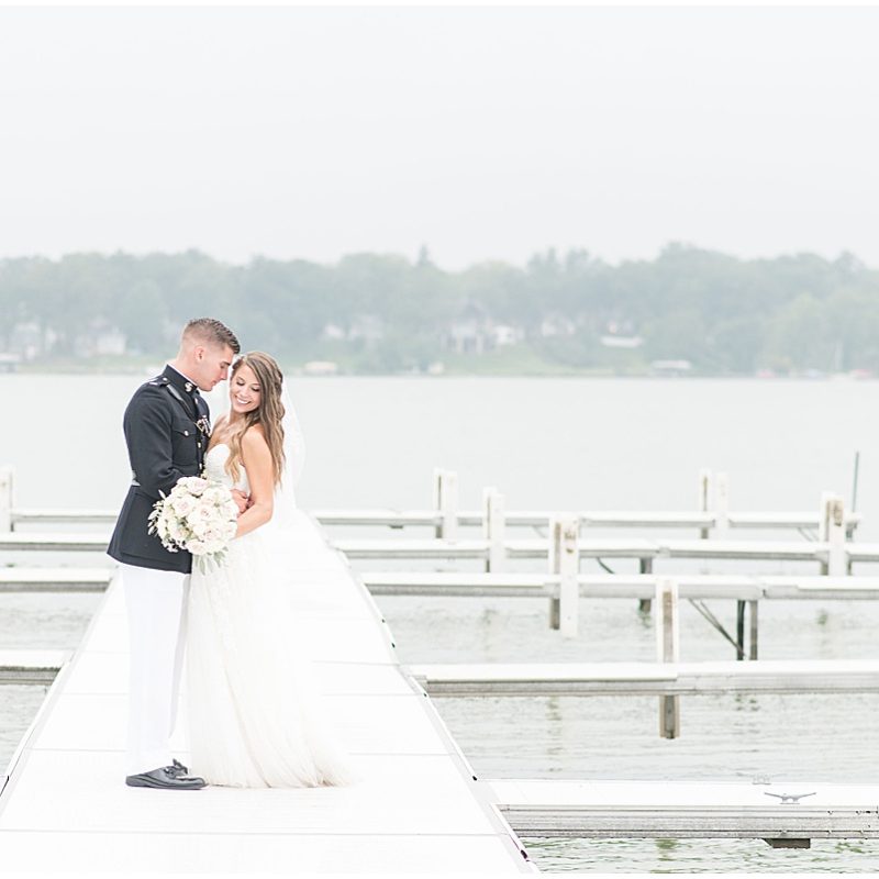 Bride and groom on dock during just married photos by Indianapolis wedding photographer Victoria Rayburn Photography