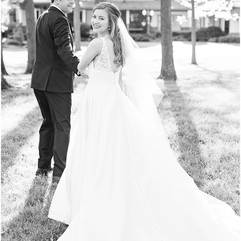 Bride and groom walking outside summer wedding by Indianapolis wedding photographer Victoria Rayburn Photography