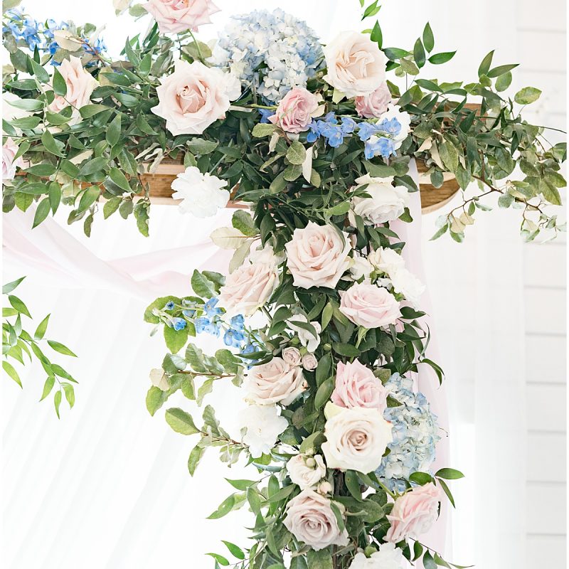 Pink and blue floral archway for wedding photos by Indianapolis wedding photographer Victoria Rayburn Photography