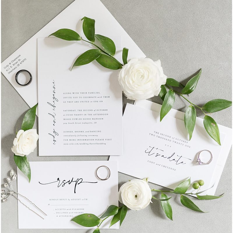 Black and white invitation flat lay by Indianapolis wedding photographer Victoria Rayburn Photography