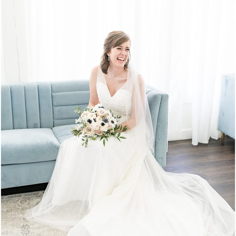 Bride laughs with wedding party during getting ready photos by Indianapolis wedding photographer Victoria Rayburn Photography