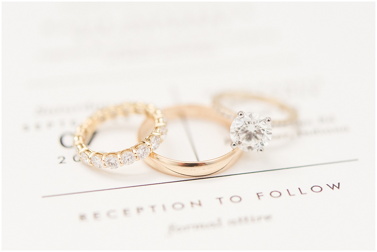 Wedding rings on invitation photographed by Indianapolis wedding photographer Victoria Rayburn Photography
