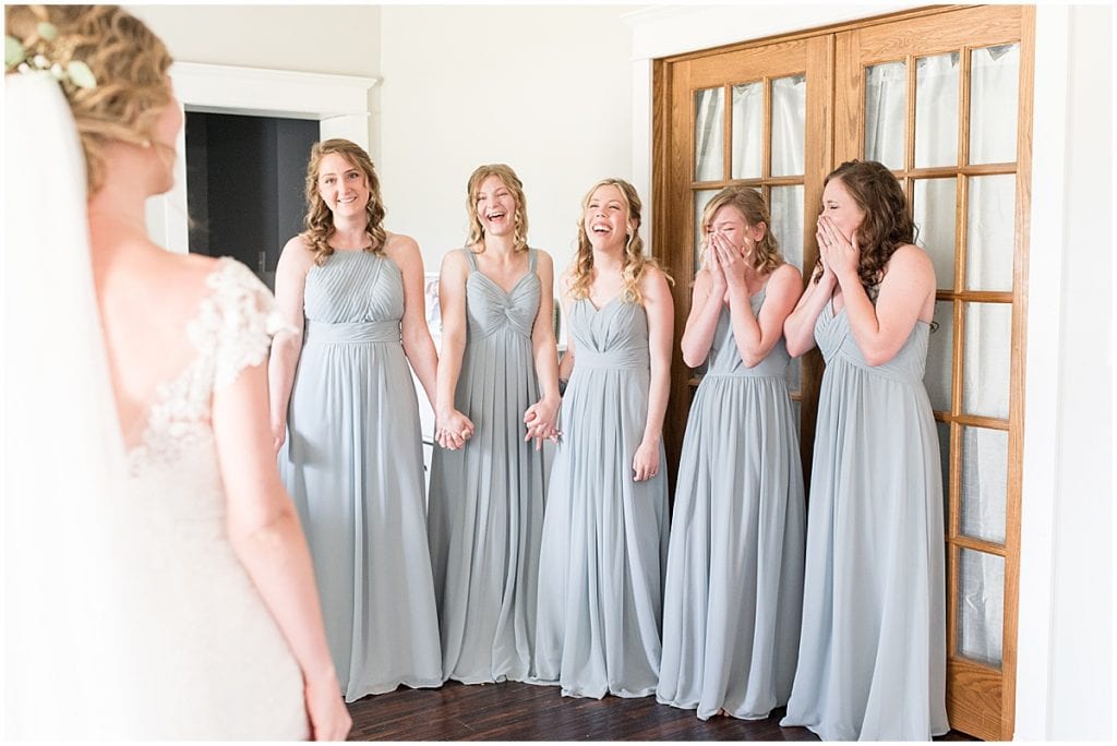 Bride first look with bridesmaids before wedding at The Matterhorn in Elkhart, Indiana