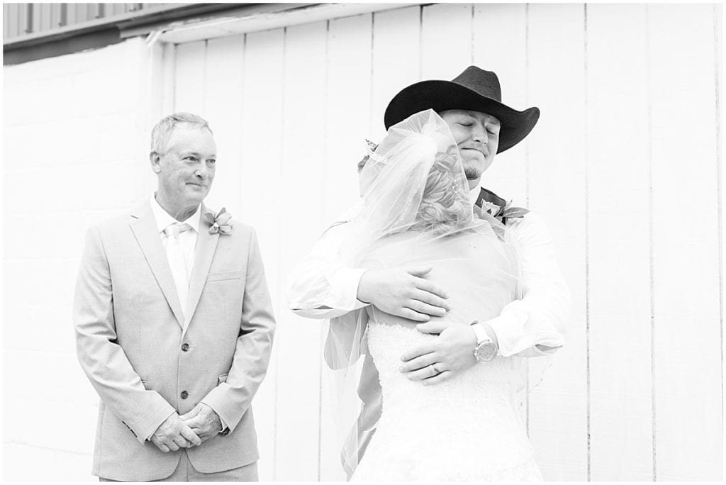 Bride's first look with her dad and brother before wedding at Wea Creek Orchard in Lafayette, Indiana