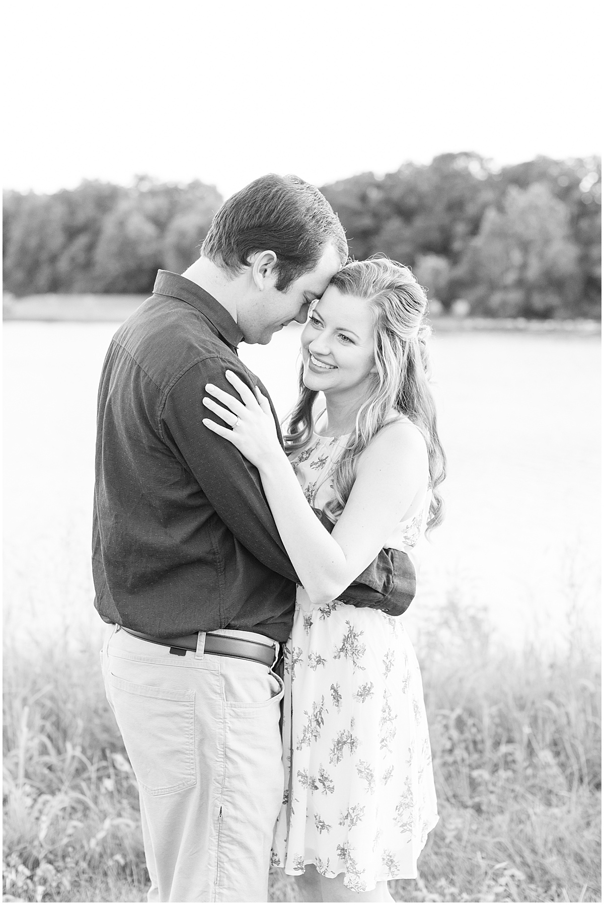 Couple hugging during Lakefront engagement photos in Lafayette, Indiana