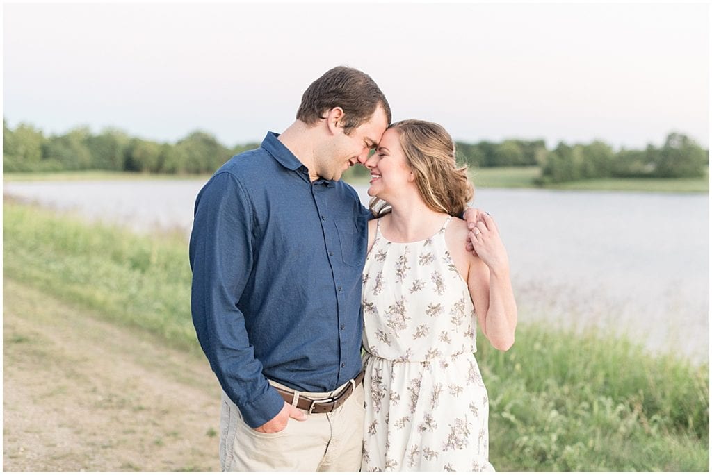 Couple looking at each other for Lakefront engagement photos in Lafayette, Indiana