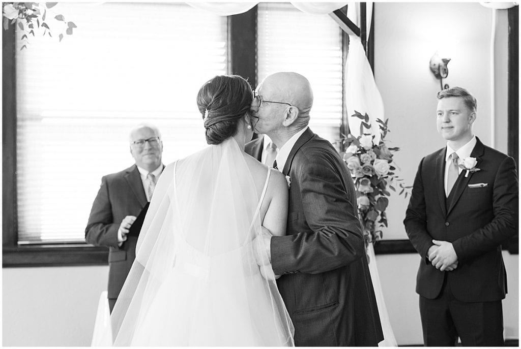 Dad giving away bride at Spohn Ballroom wedding in Goshen, Indiana