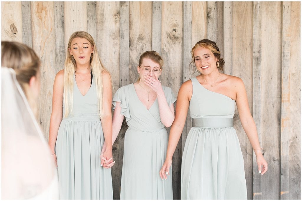 Bride's first look with bridesmaids before wedding at Whippoorwill Hill in Bloomington, Indiana