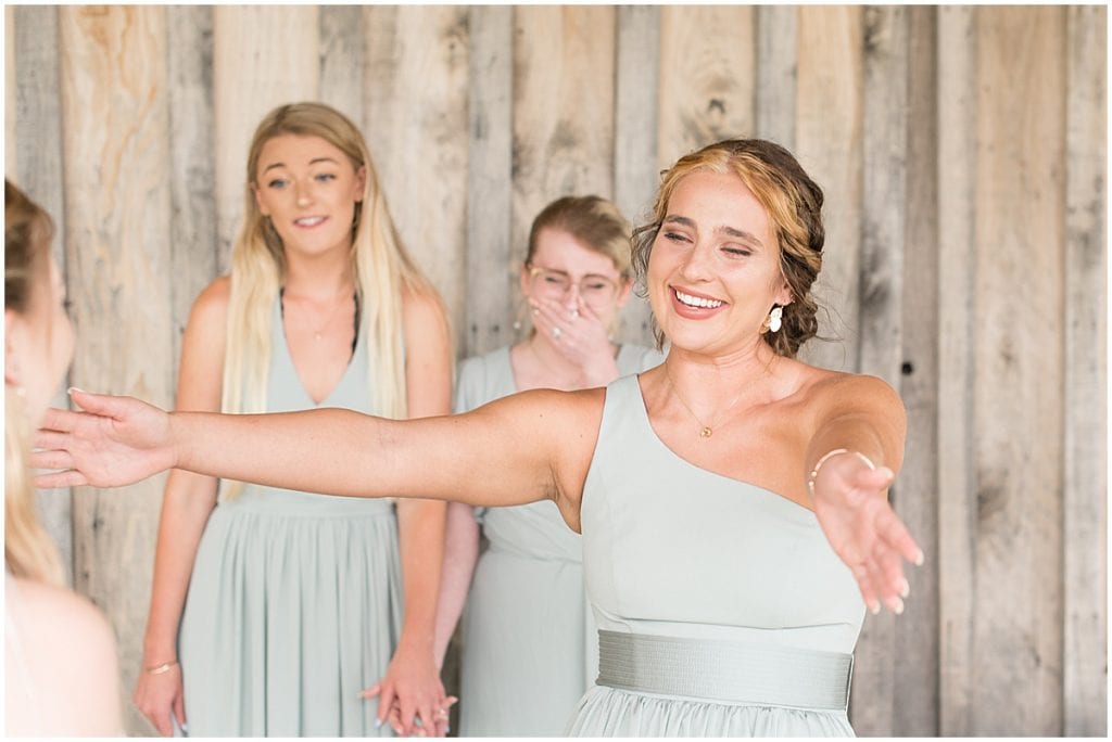 Bride's first look with bridesmaids before wedding at Whippoorwill Hill in Bloomington, Indiana
