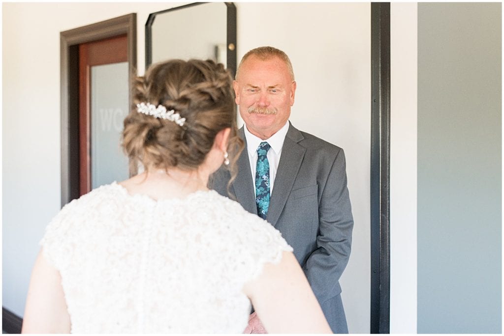 First look with Father of the bride in intimate wedding at Holliday Park in Indianapolis