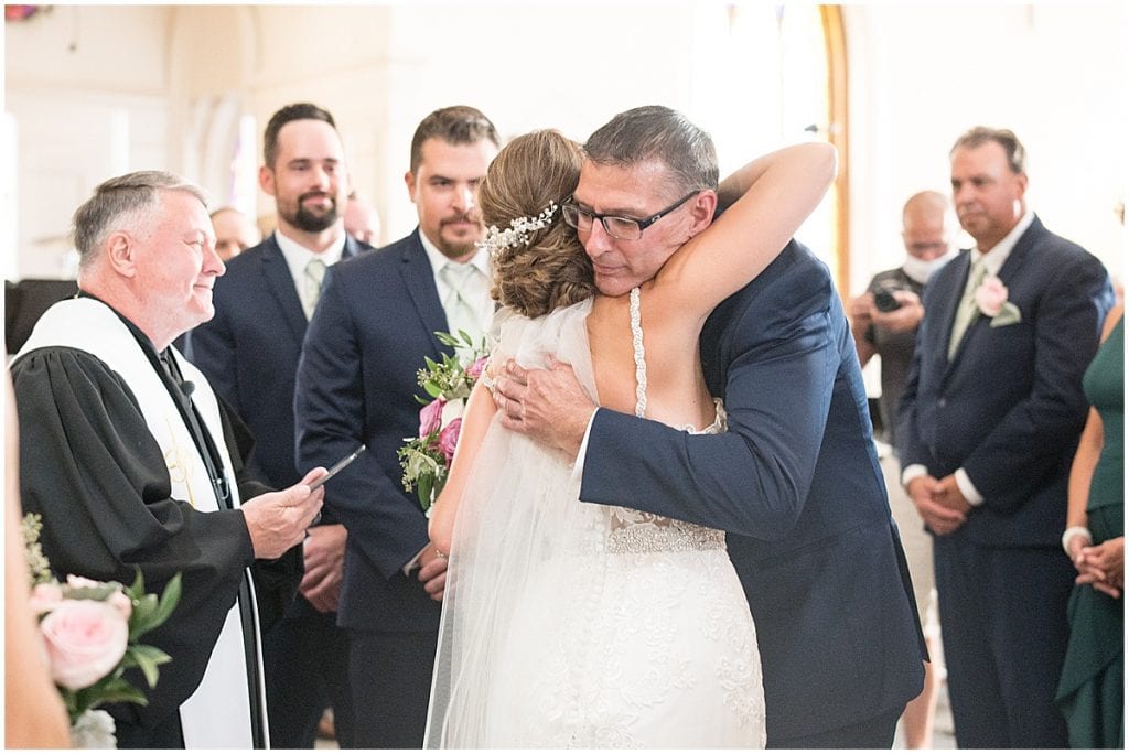 Bride hugging her father at Trinity United Methodist Church in Rensselaer, Indiana.