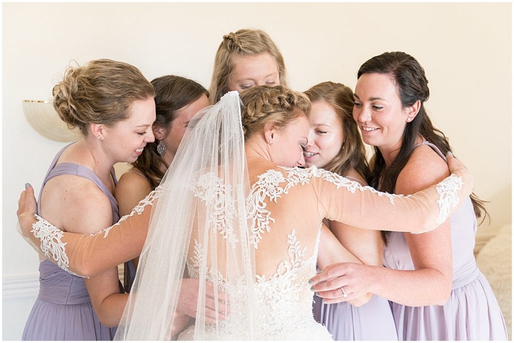 First look with bridesmaids for wedding at Wagner Angus Barn in Wolcott, Indiana