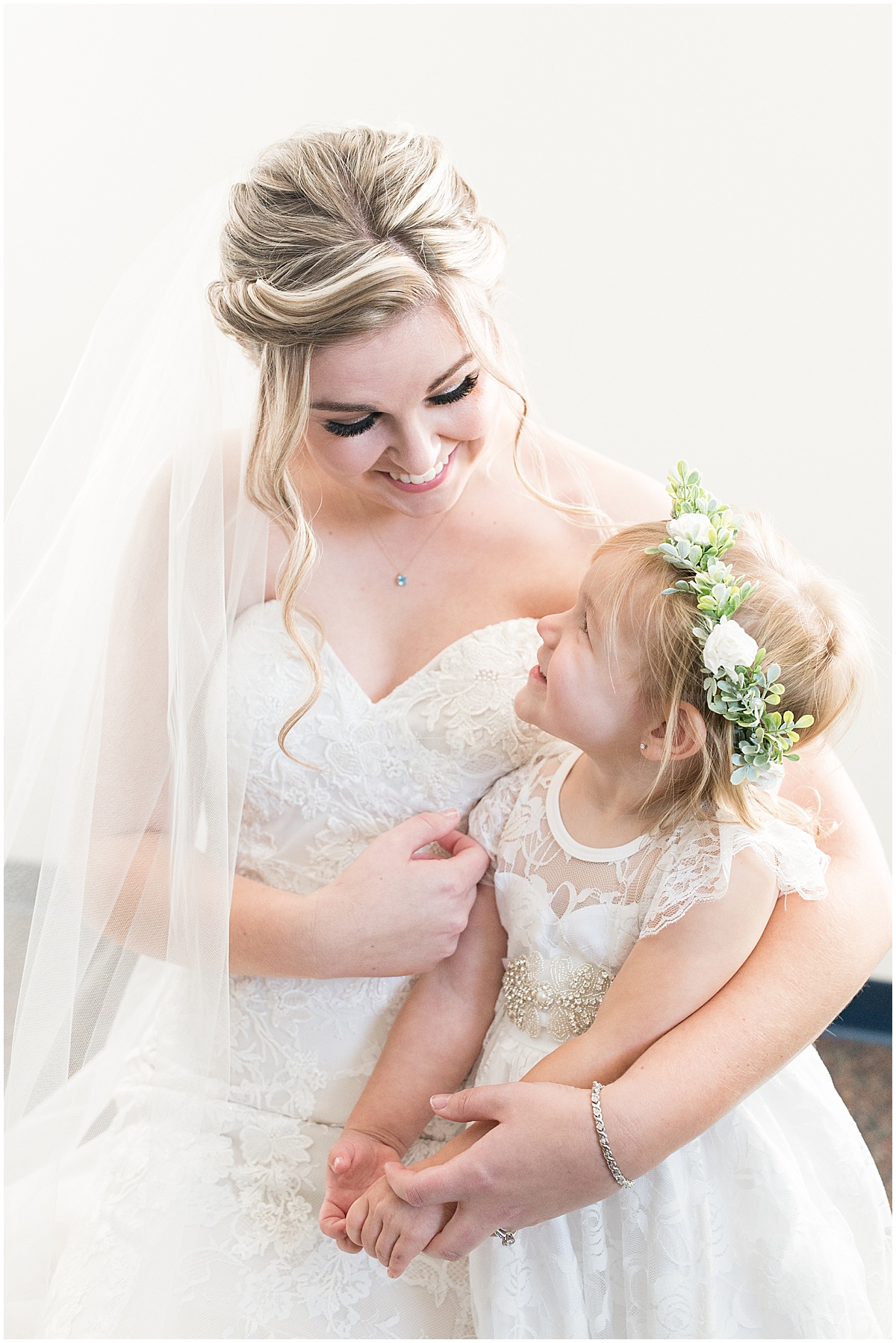 Bridal portrait with flower girl at Cornerstone Christian Church in Brownsburg, Indiana