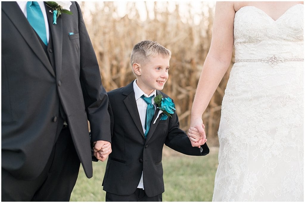 Bride and groom with son after Cornerstone Christian Church wedding
