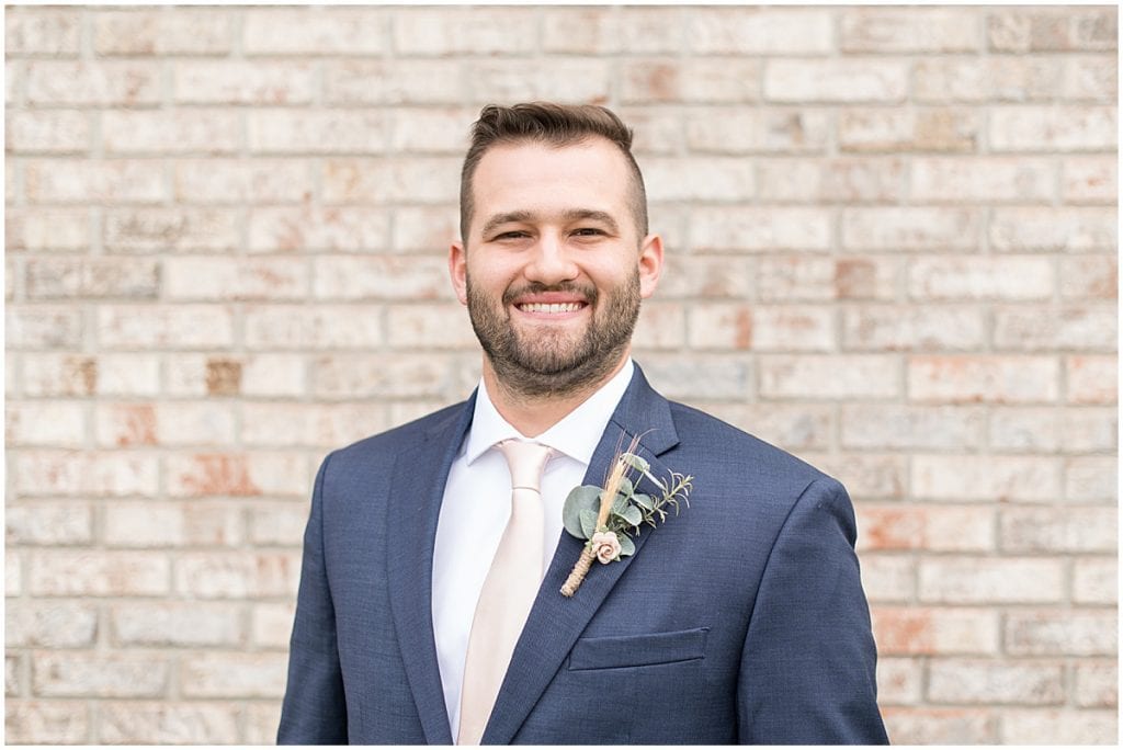 Groom portraits outside Innovation Church in Lafayette, Indiana