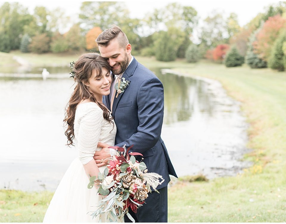 Bride and groom portraits next to pond in Lafayette, Indiana