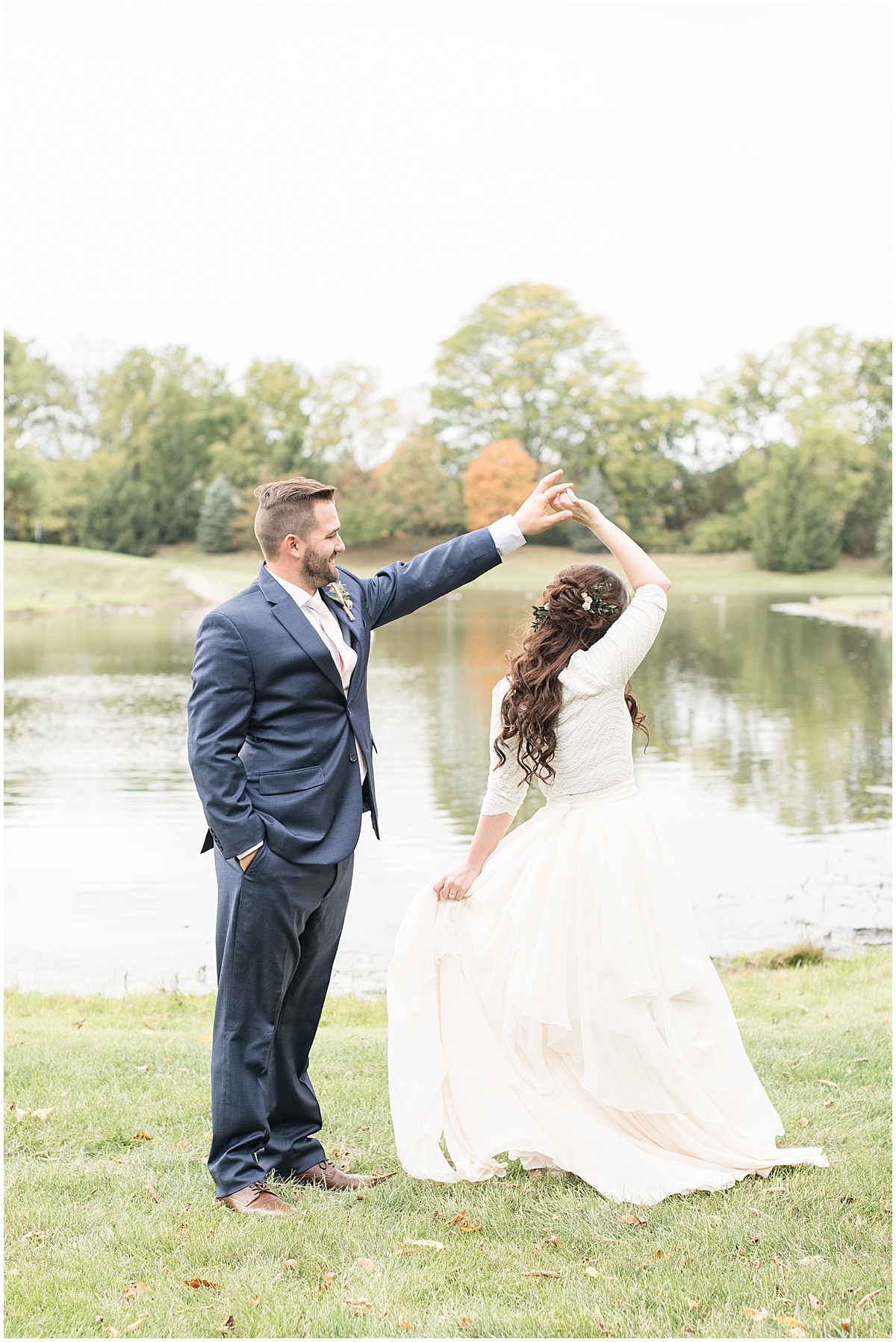 Bride and groom dancing next to pond in Lafayette, Indiana