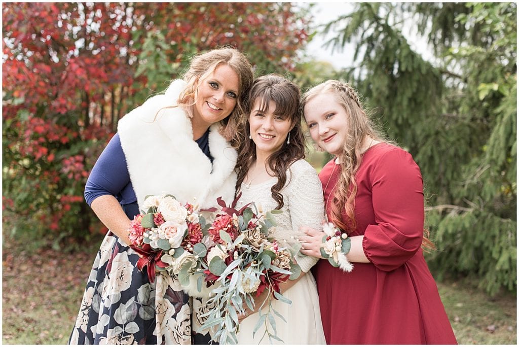 Bride with bridesmaids before fall wedding in Lafayette, Indiana