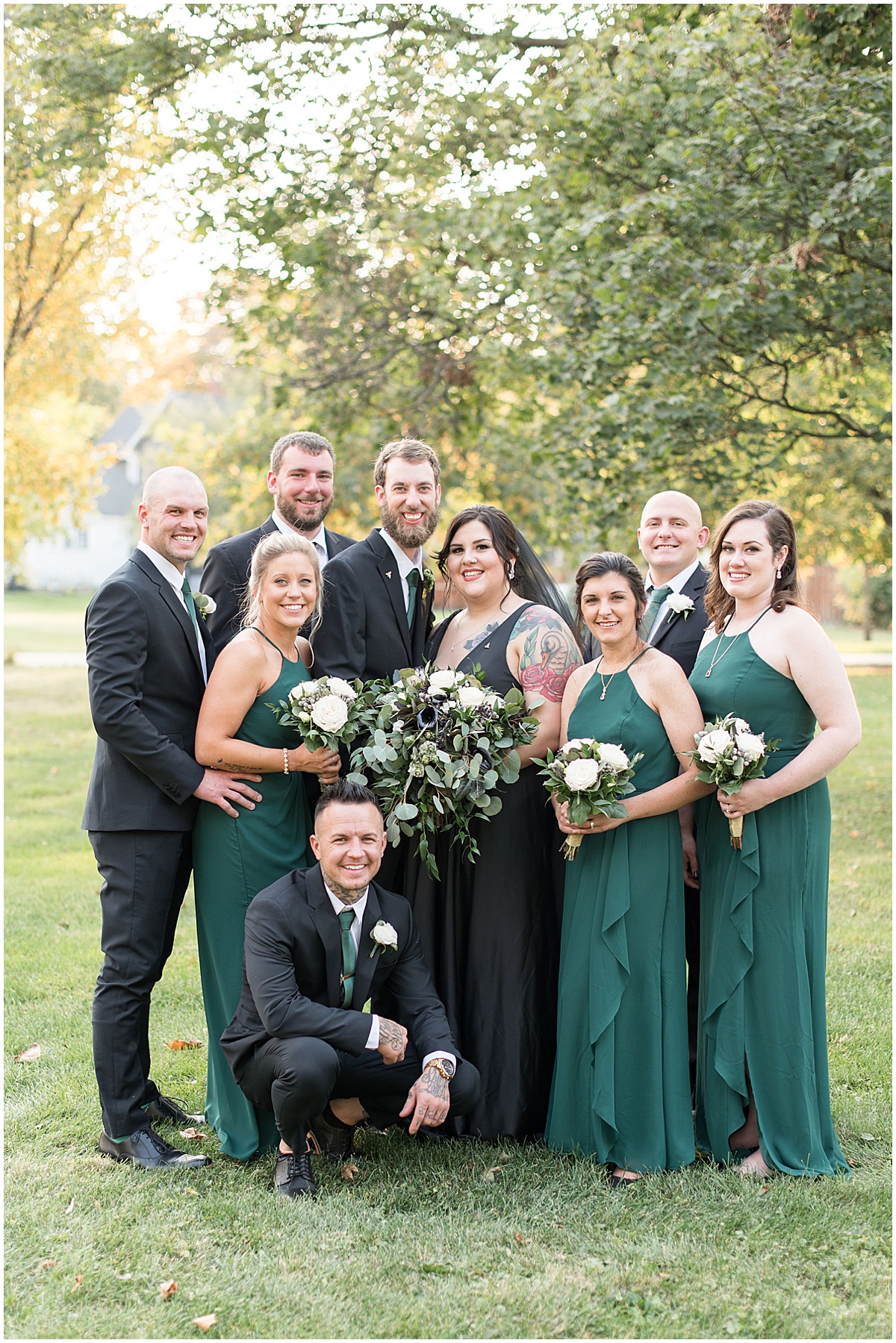 Bridal party ready for eMbers Venue wedding in Rensselaer, Indiana with a bride wearing black by Victoria Rayburn Photography