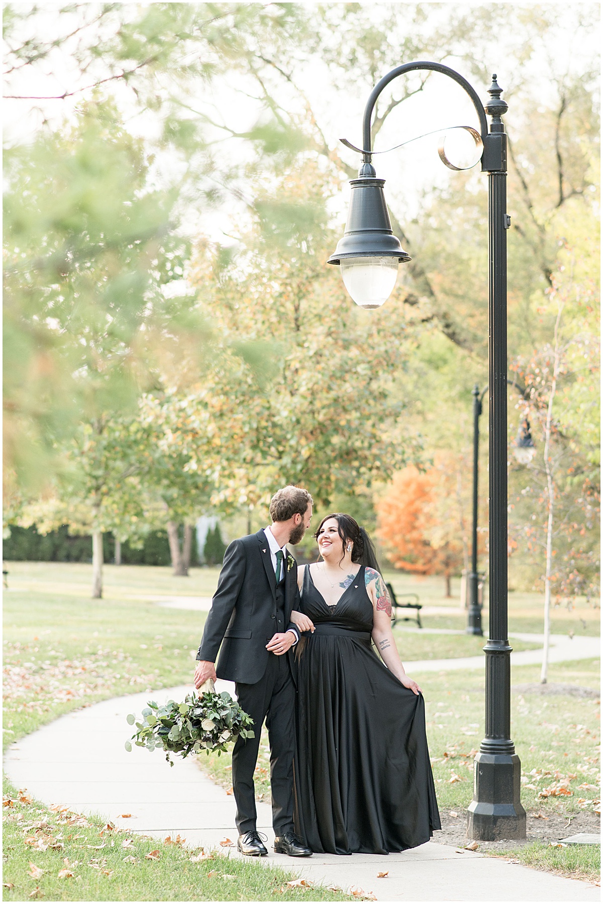 Just married photos after eMbers Venue wedding in Rensselaer, Indiana with a bride wearing black by Victoria Rayburn Photography