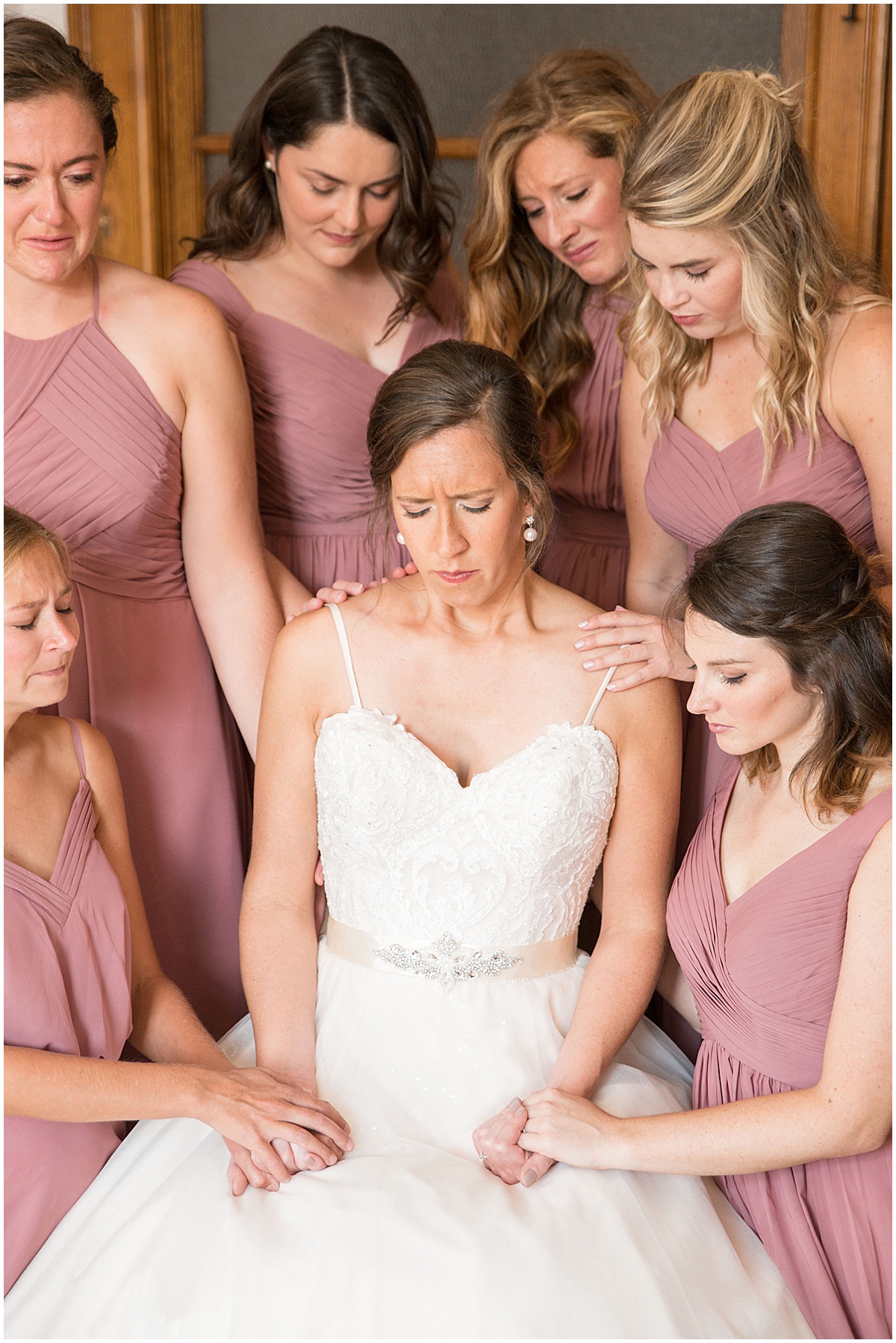Pre wedding prayer before Spohn Ballroom wedding in Goshen, Indiana by Victoria Rayburn Photography