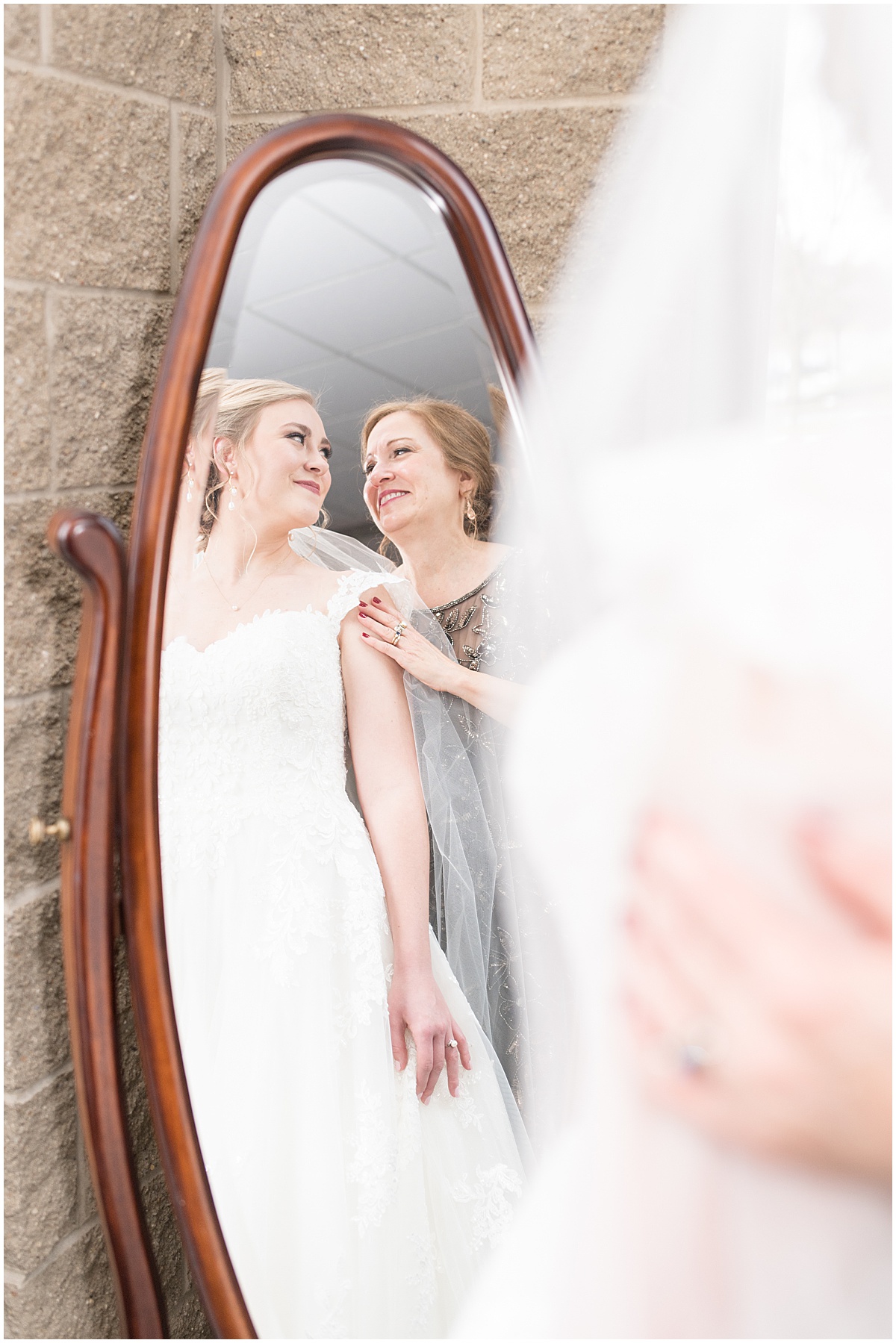 Bride getting ready for winter wedding at the Cathedral of Saint Mary in Lafayette, Indiana