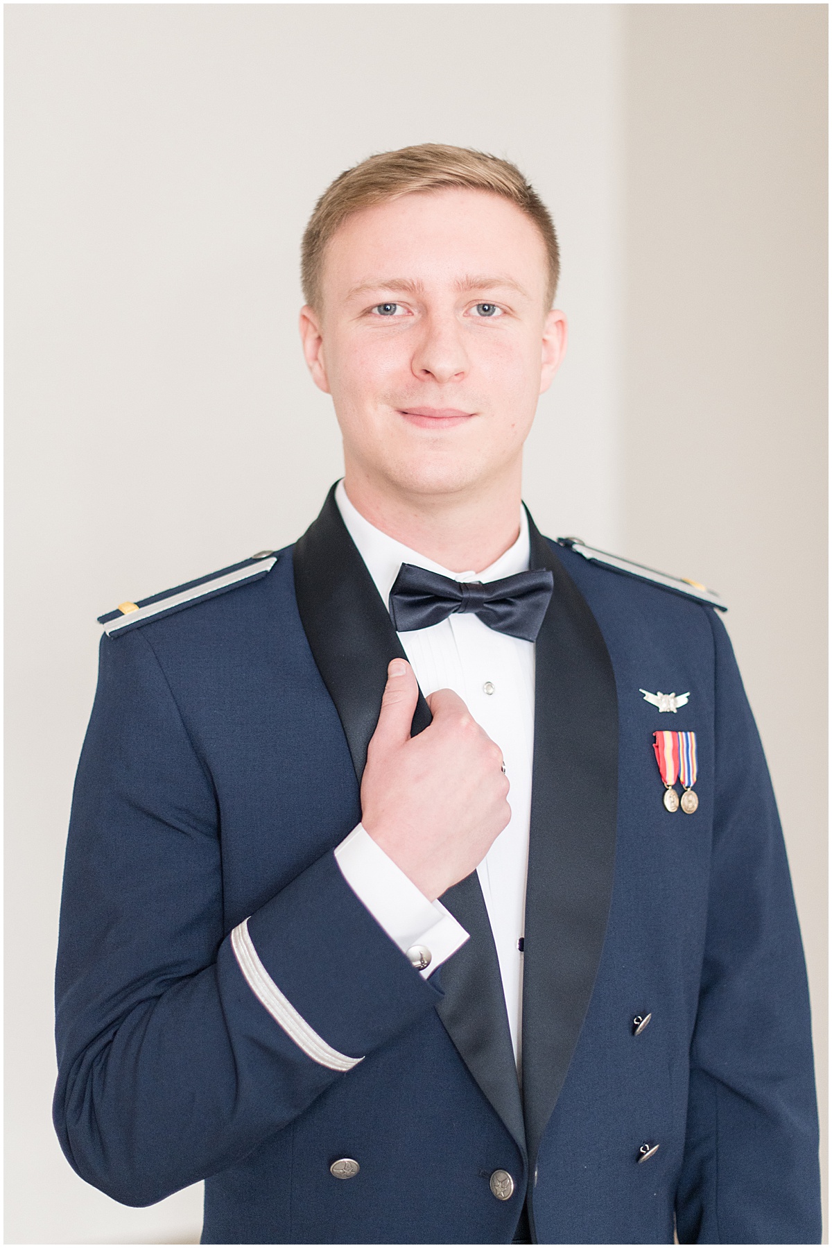 Military groom portraits at winter wedding at the Cathedral of Saint Mary in Lafayette, Indiana