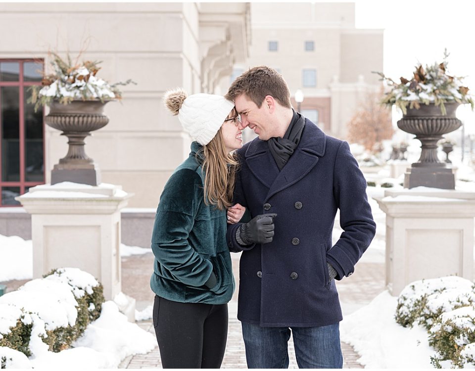 Newly engaged couple poses for photos after proposal at The Palladium in Carmel, Indiana