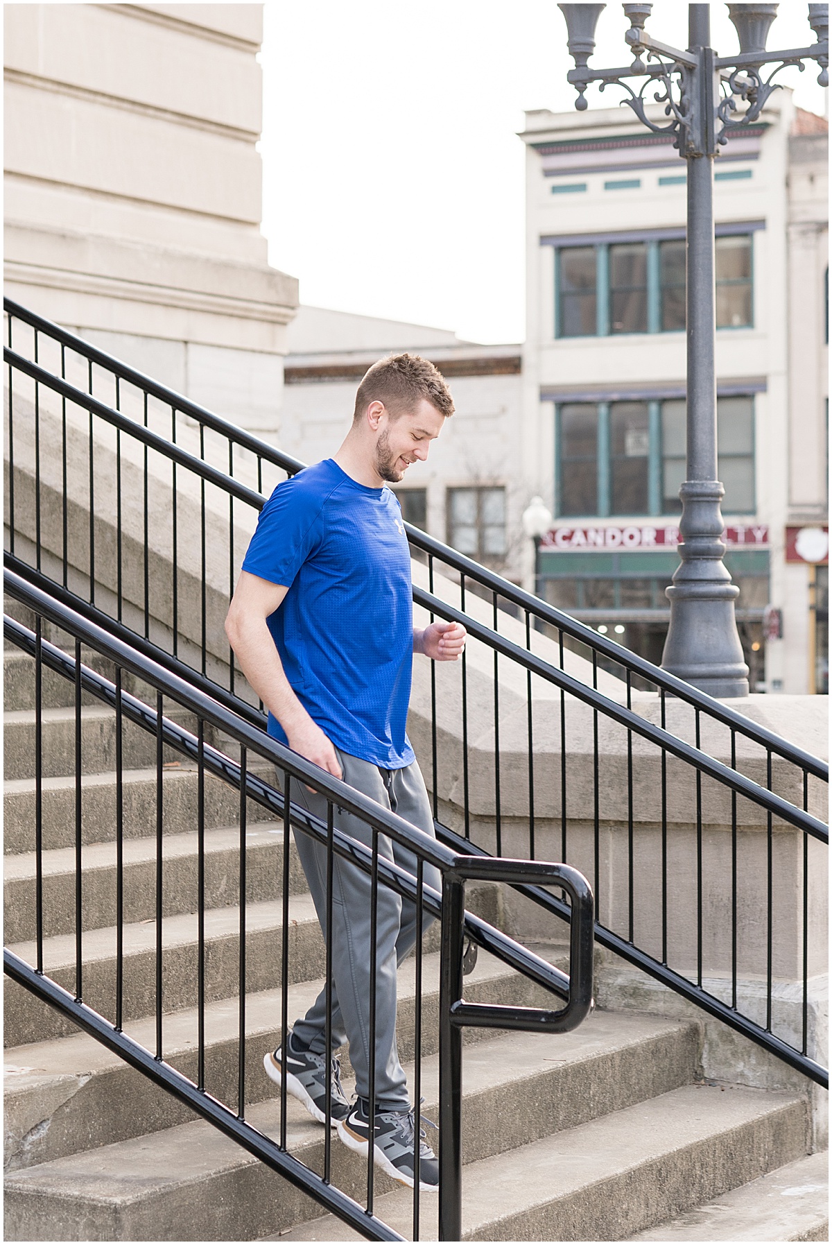 Frank Berenda running stairs for personal trainer branding photos in downtown Lafayette, Indiana
