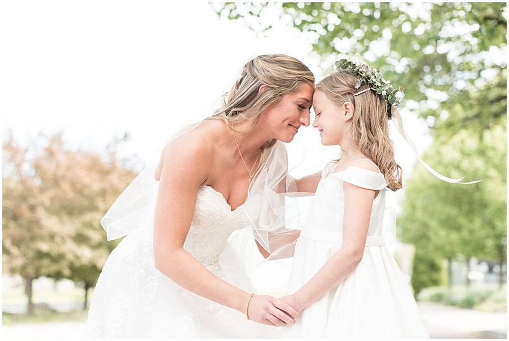 Flower girl and bride share special moment before Barn at Bay Horse Inn wedding in Greenwood, Indiana