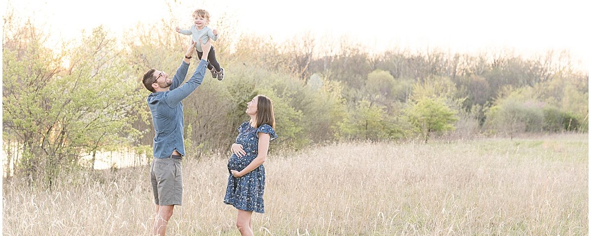 Spring maternity photos at Fairfield Lakes Park in Lafayette, Indiana with toddler