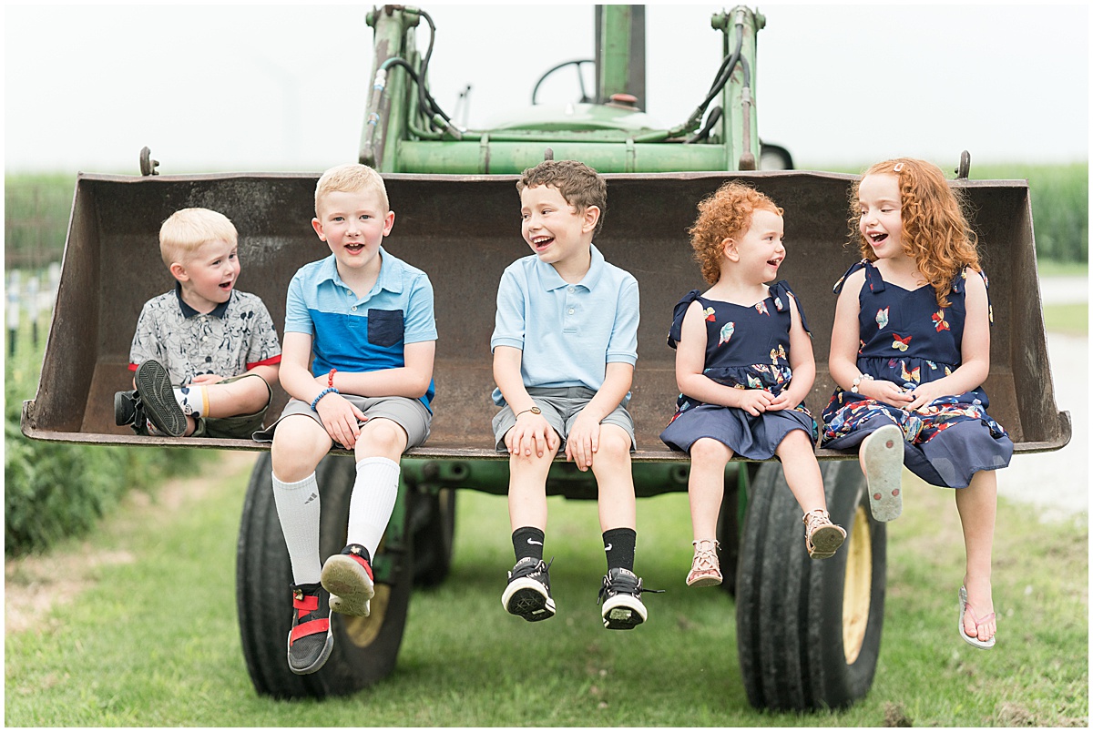 Extended family photos on the farm in Remington, Indiana with a tractor