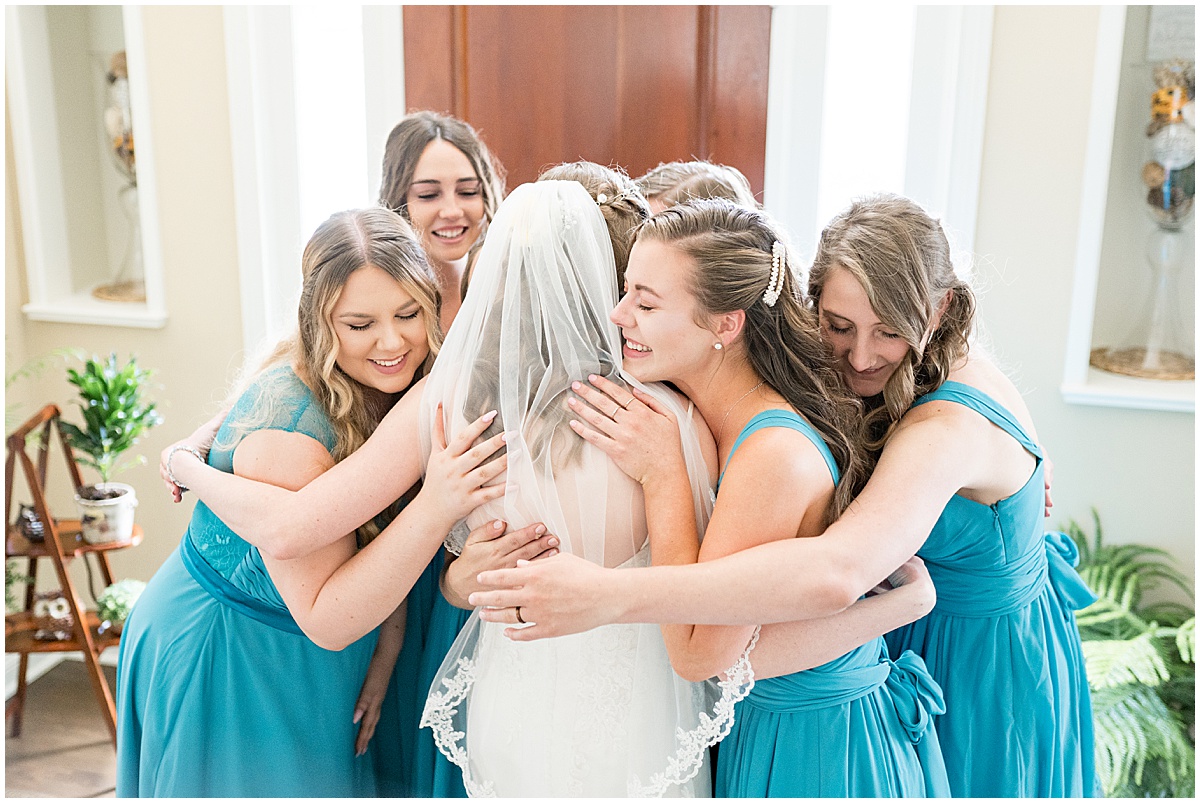 Bridesmaids reaction to bride before River Glen Country Club Wedding