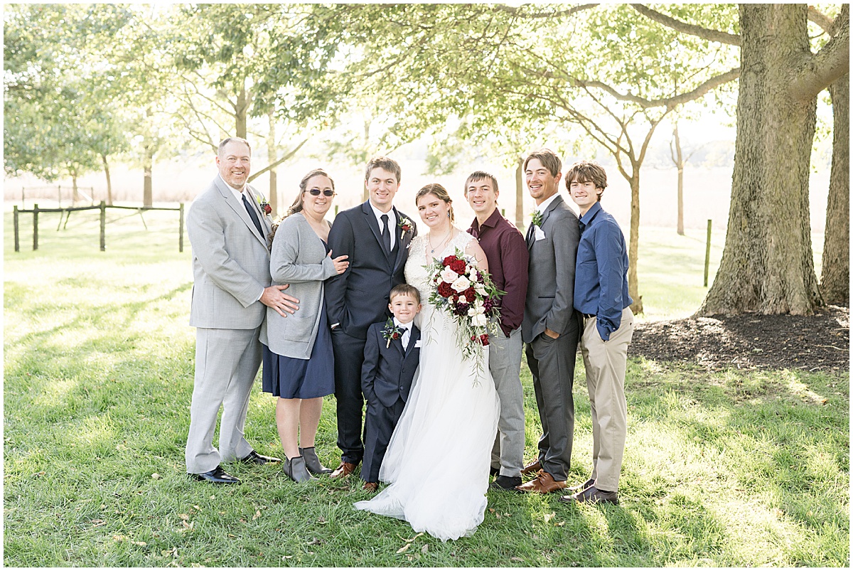 Family photos after fall wedding at Vintage Oaks Banquet Barn in Delphi, Indiana