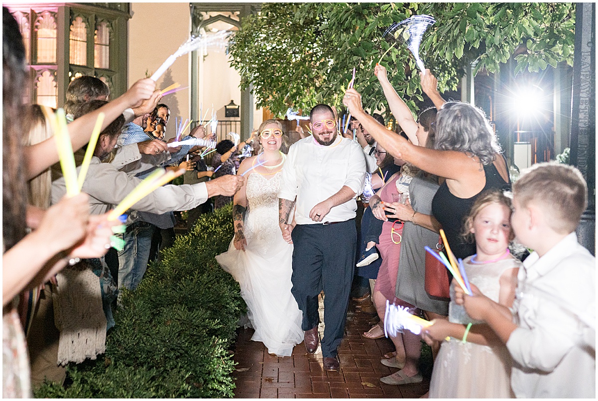 Exit of bride and groom from Fowler House Mansion wedding in Lafayette, Indiana by Victoria Rayburn Photography