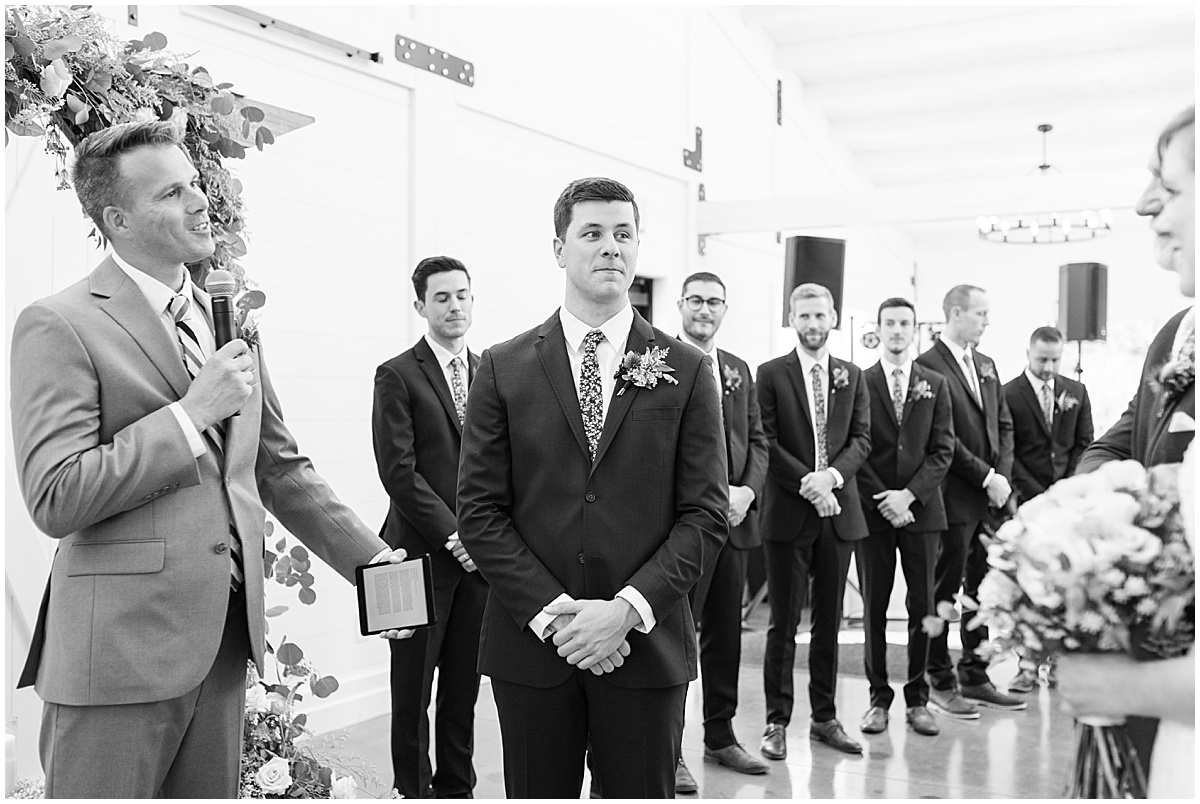 Walking down the aisle at wedding at The Sixpence in Whitestown, Indiana by Indianapolis wedding photographer Victoria Rayburn