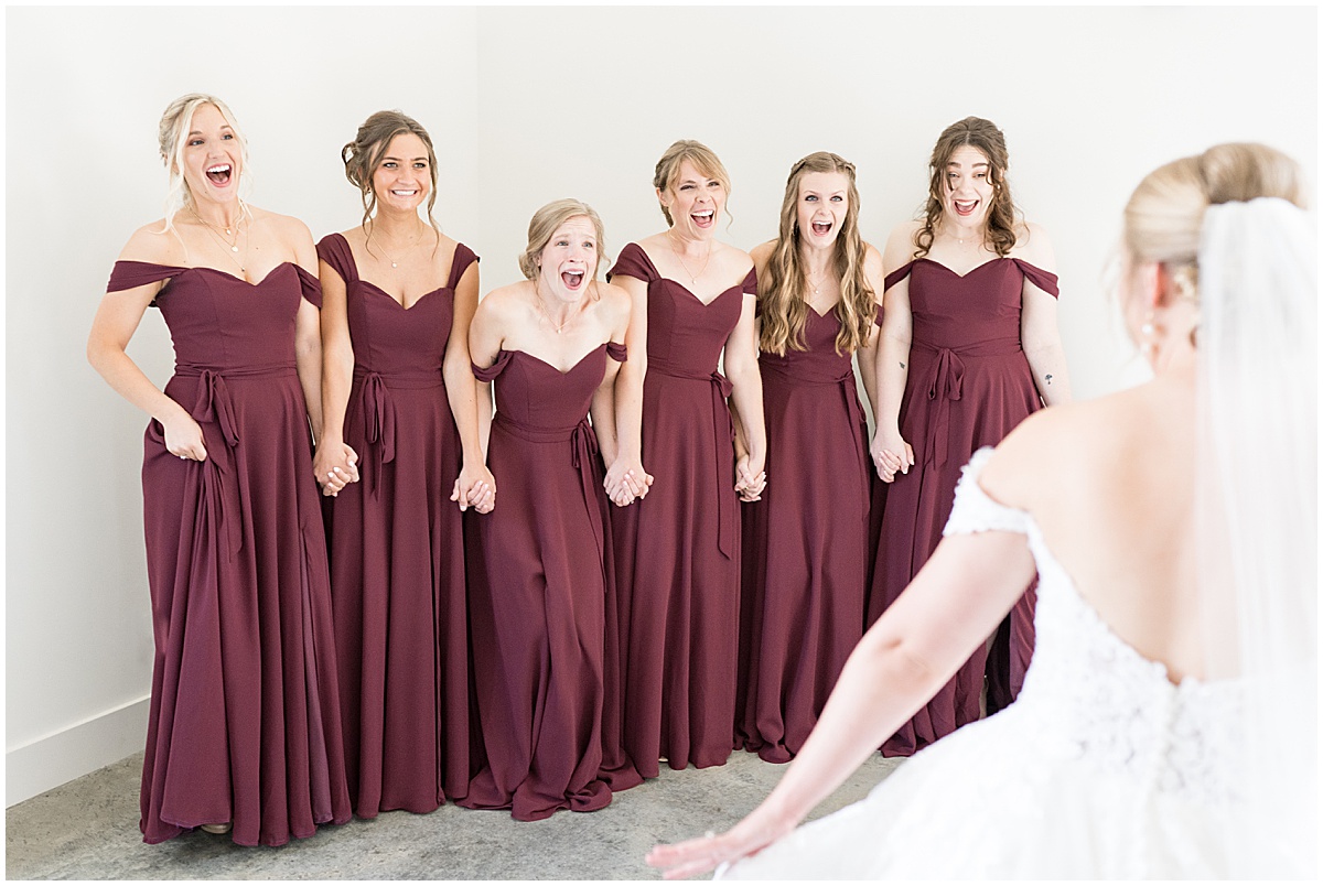 Bridesmaid's reaction before wedding reception at New Journey Farms in Lafayette, Indiana photographed by Lafayette, Indiana wedding photographer Victoria Rayburn