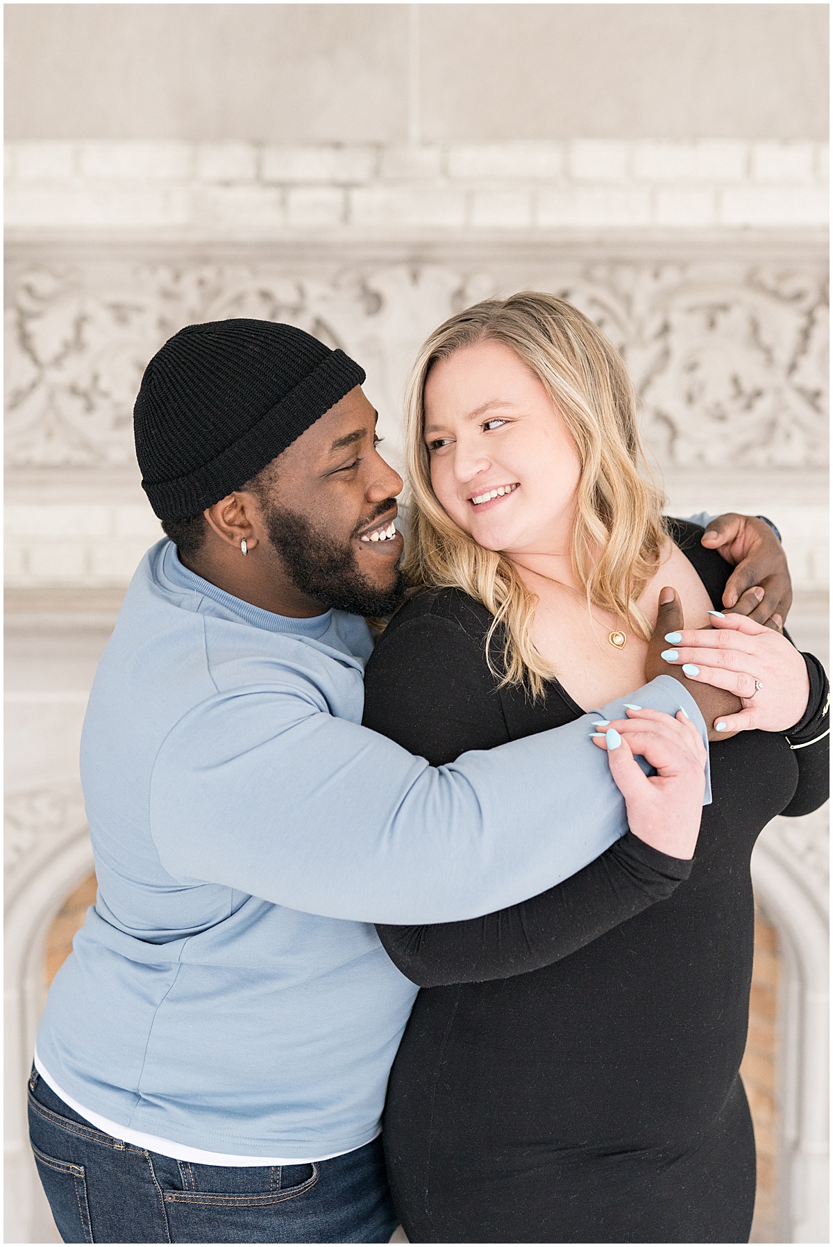 Winter Laurel Hall engagement photos in Laurel Hall’s solarium by Indianapolis wedding photographer Victoria Rayburn Photography