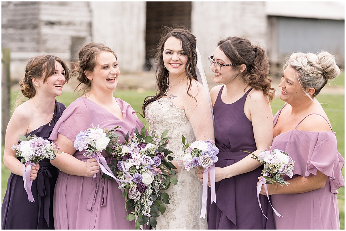 Bride and her bridesmaids at wedding at Finkbiner Gala Barn in Veedersburg, Indiana