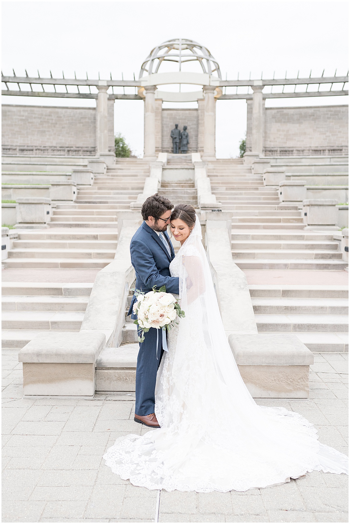 Newlyweds on steps at Coxhall Gardens in Carmel, Indiana